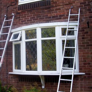 leaded glass window being reflashed